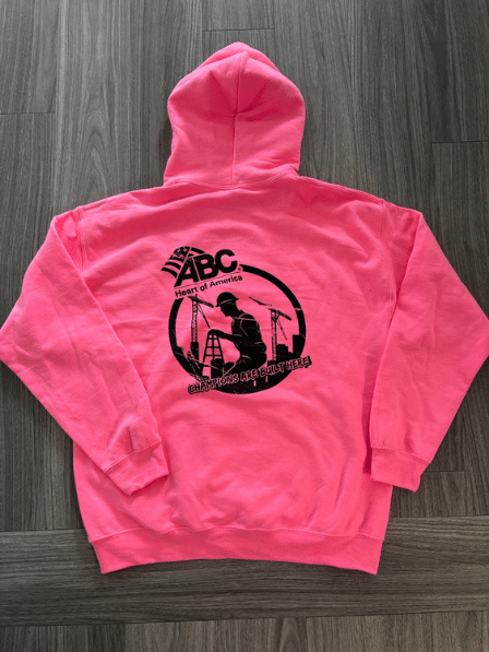 A pink ABC HOA sweatshirt